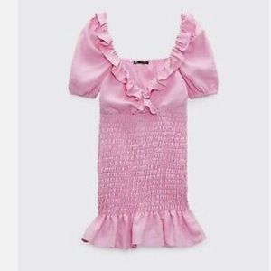 Pink linen ruffle mini dress.
